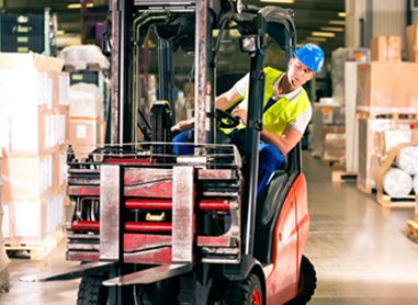 A man steering a forklift